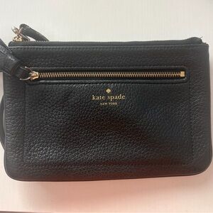 kate spade black pebbled leather wristlet with gold logo